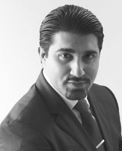 Talal-Malik-Official-Photo-Large-B-W-En 1